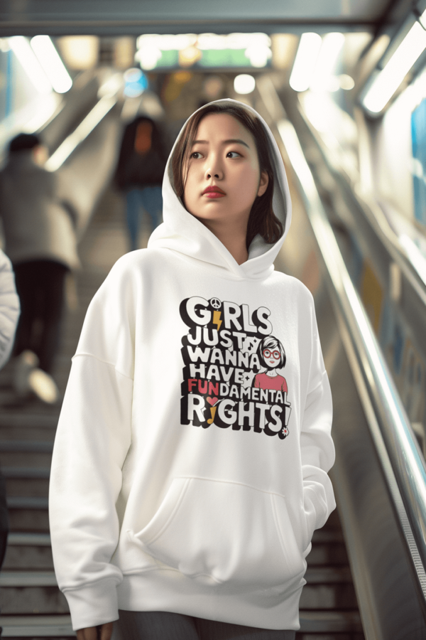 woman wearing a stylish hoodie that reads, Girls just wanna have FUNdamental rights